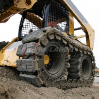 McLaren Rubber over-the-tire tracks for skids teer loaders